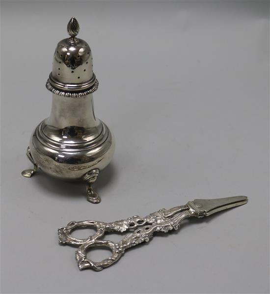 A 1970s silver sugar caster, Edward Barnard & Sons, London, 1973 and a pair of modern silver grape scissors.